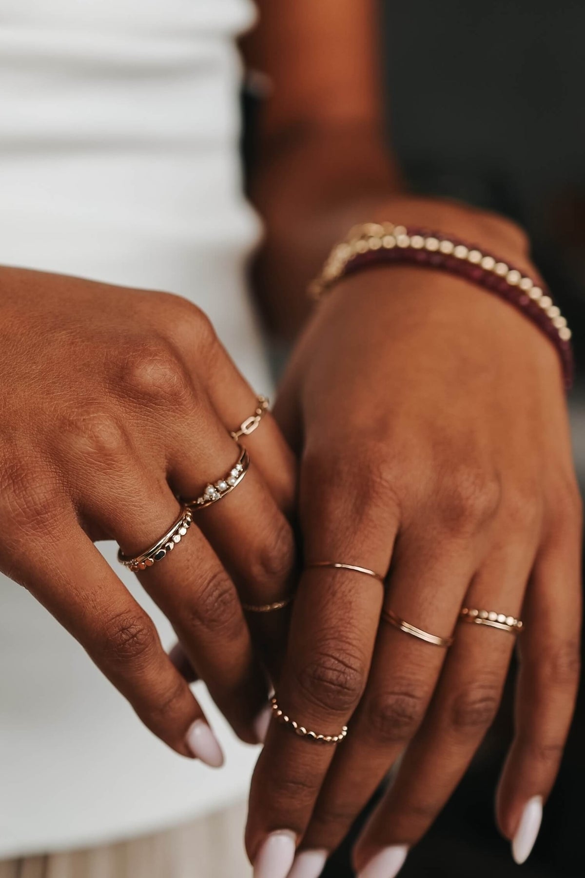 hands showing rings and bracelets