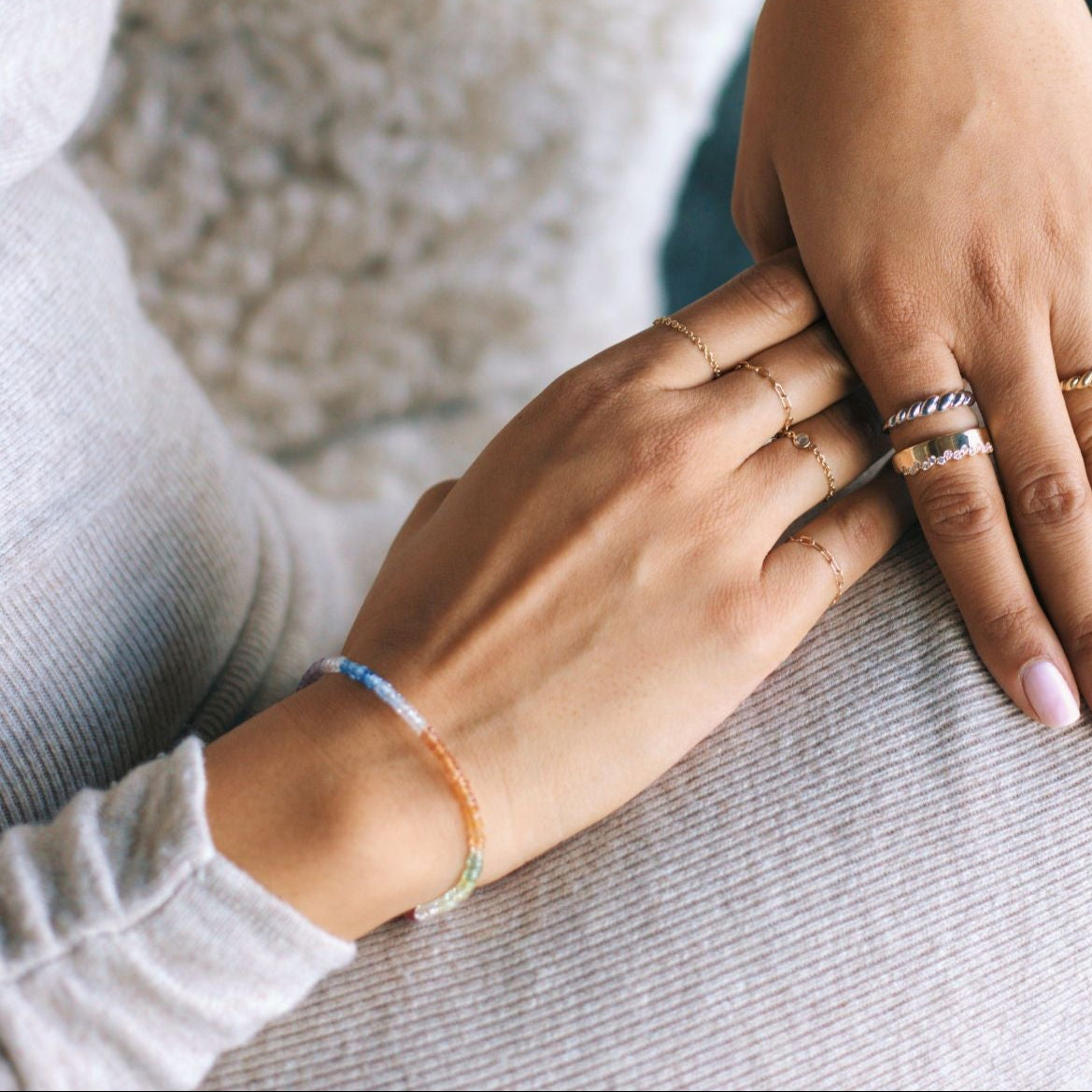 woman wearing sapphire diamond gold jewelry