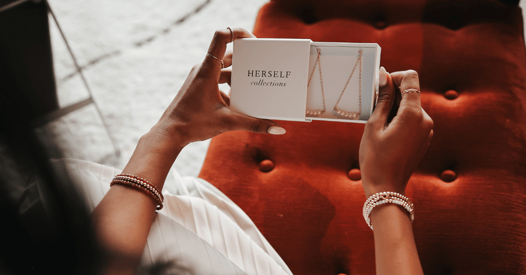 Herself Collections logo