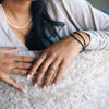 woman wearing gold rings and bracelets