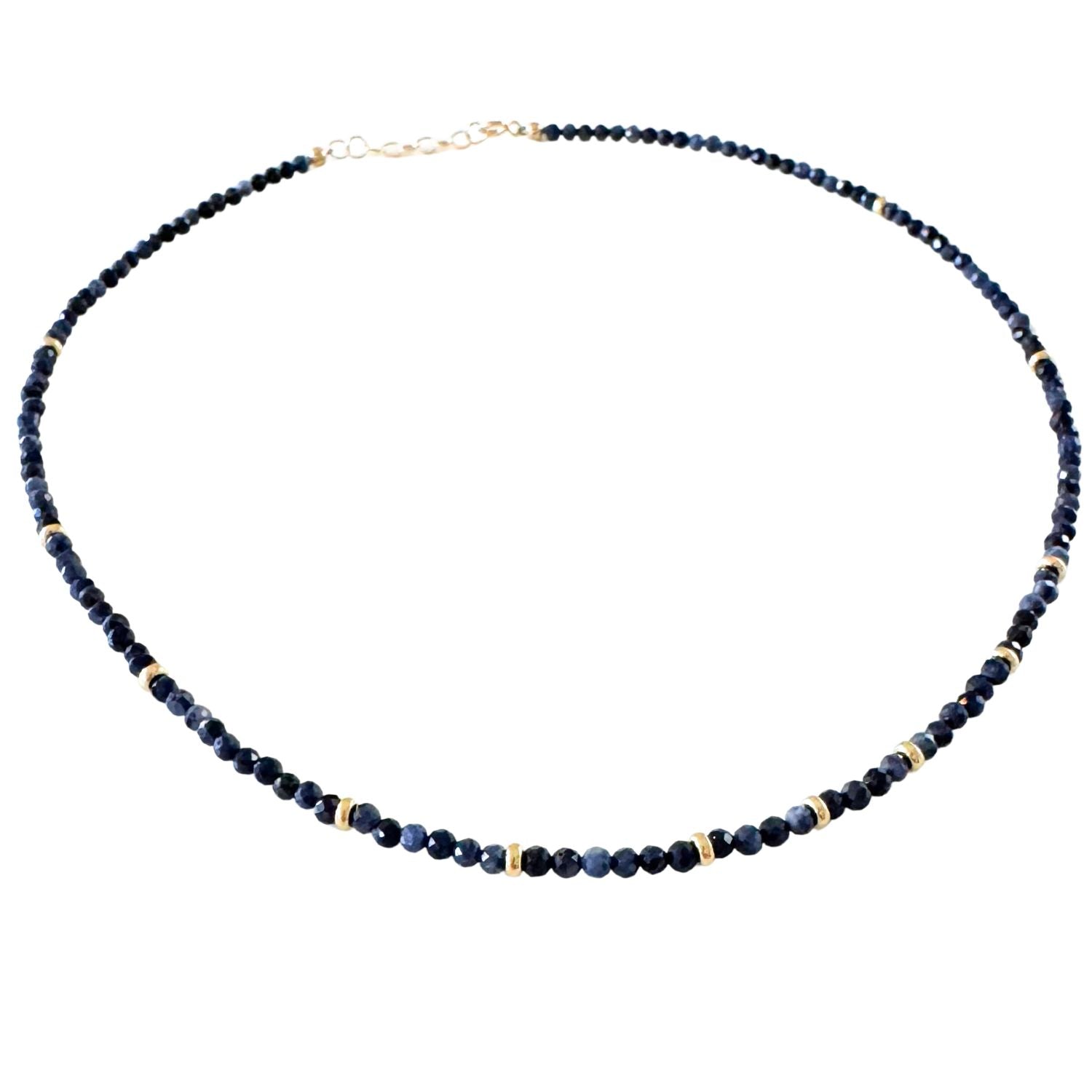 Necklace with blue beads on a white background