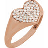 Rose gold heart-shaped ring with diamond accents on a white background