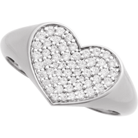 Heart-shaped silver white gold ring with embedded diamonds on a white background