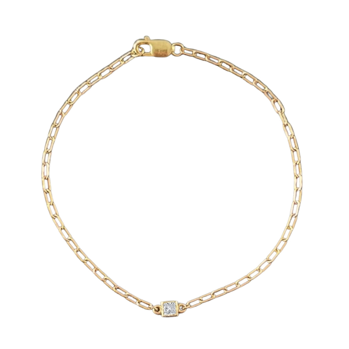 14k gold fairmined paperclip chain bracelet with lab diamond bezel on white background