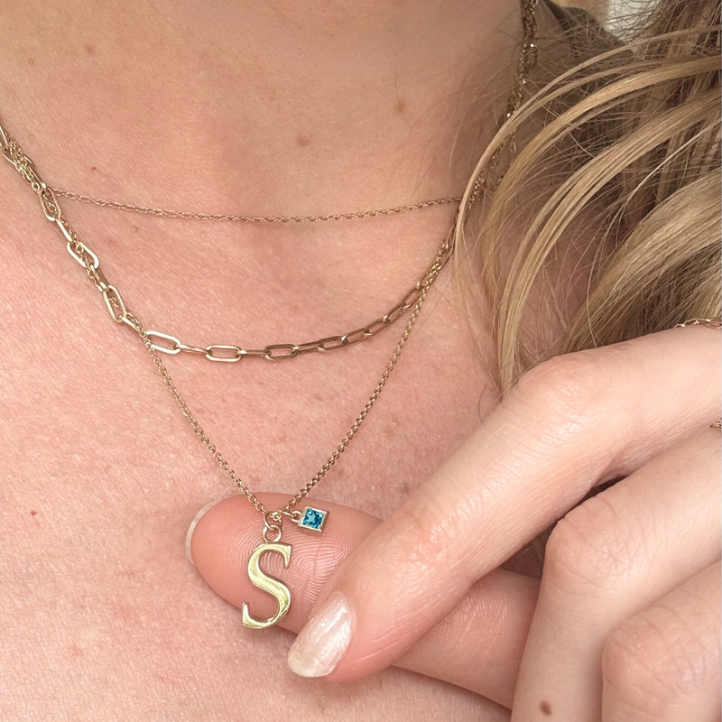 14k gold letter necklace with aquamarine stone