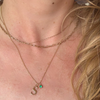 14k gold letter necklace with emerald stone