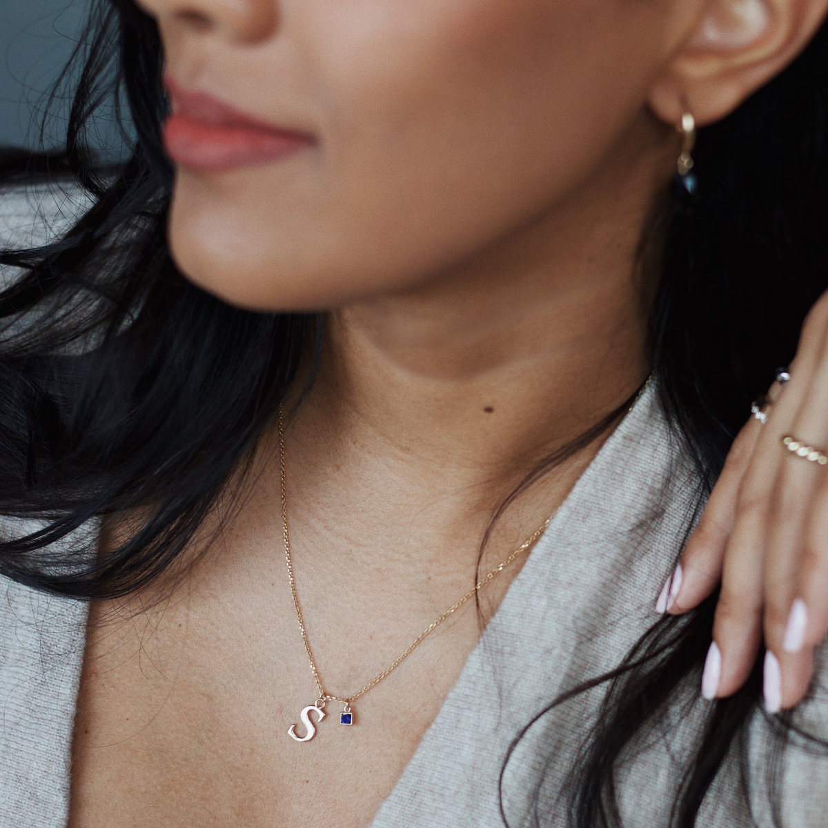 14k gold letter necklace with sapphire