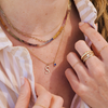 14k gold letter necklace with sapphire gem