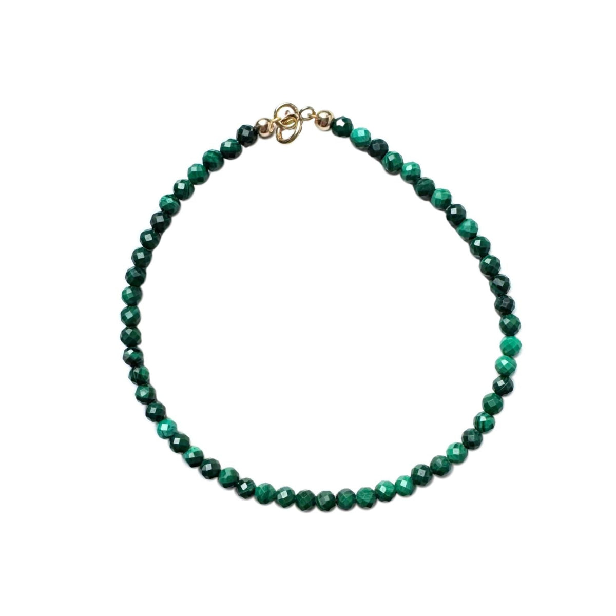 Malachite beaded bracelet with a 14k gold clasp on a white background
