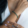 woman wearing a malachite beaded bracelet