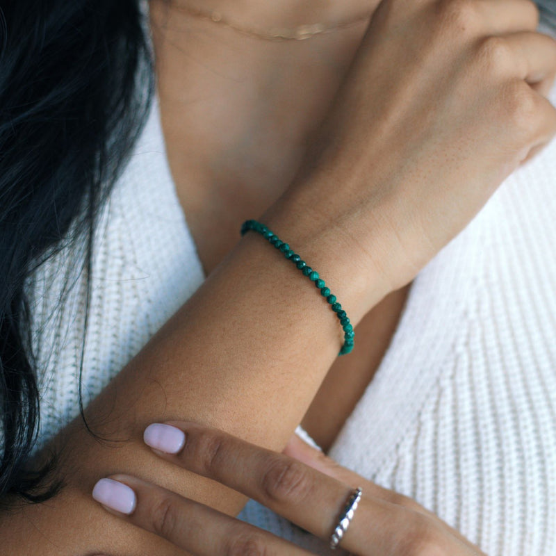 woman wearing a malachite beaded bracelet