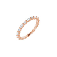 Rose gold ring with diamonds on a white background