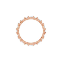 Rose gold ring with small diamonds on a white background