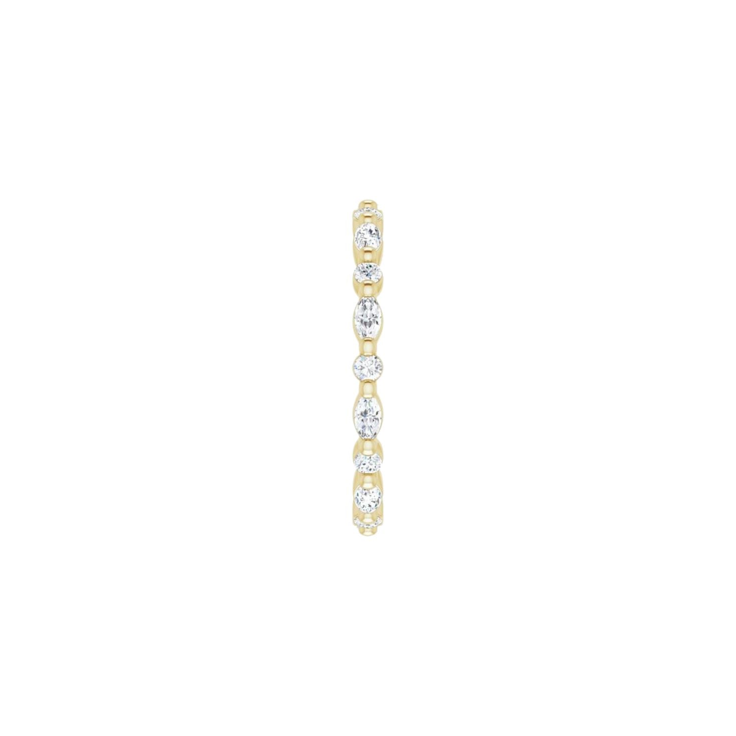 Gold ring side view with diamond stones on a white background