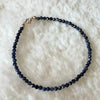 Blue Sapphire and Gold bracelet on shearling.