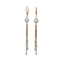 Pair of lever back pearl chain earrings on white background