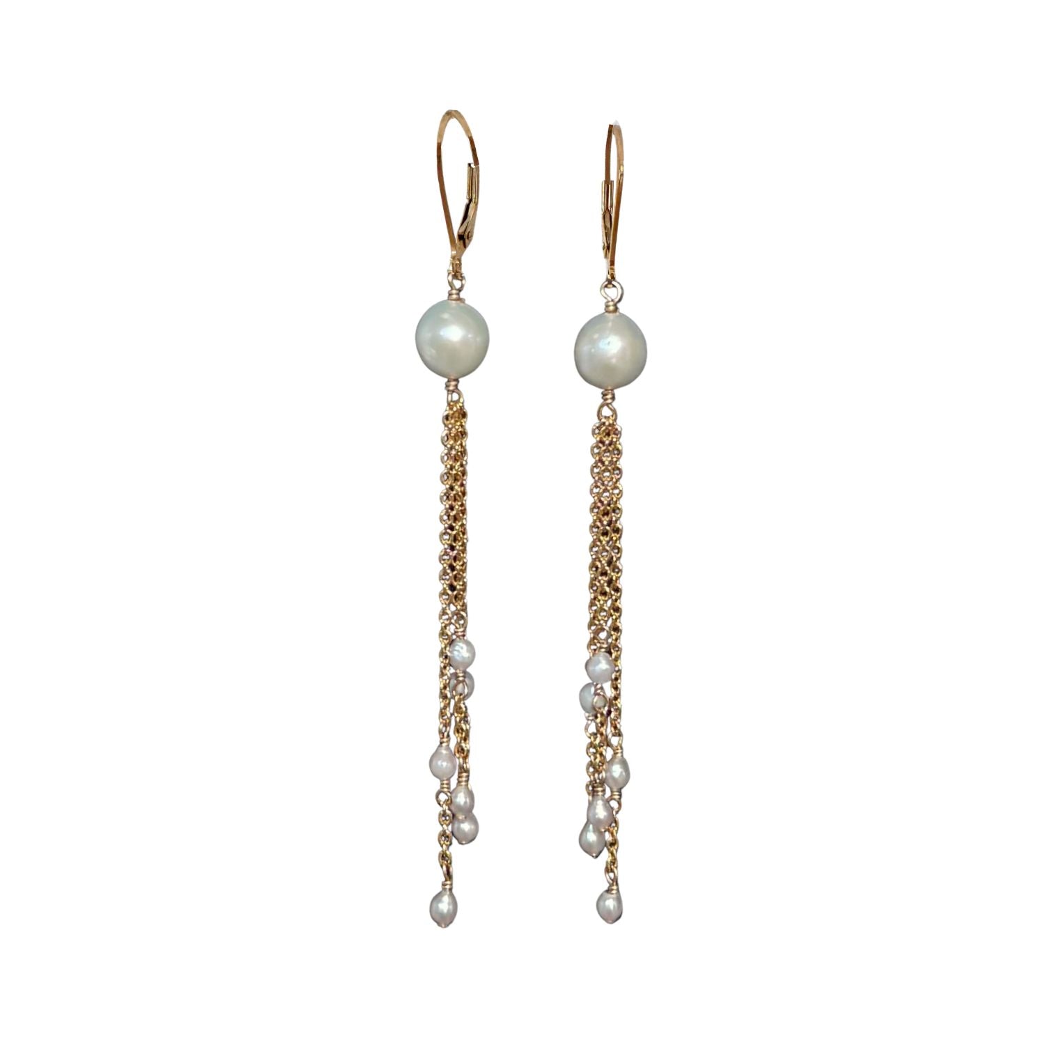 Pair of lever back pearl chain earrings on white background