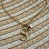 14k gold letter necklace with garnet birthstone