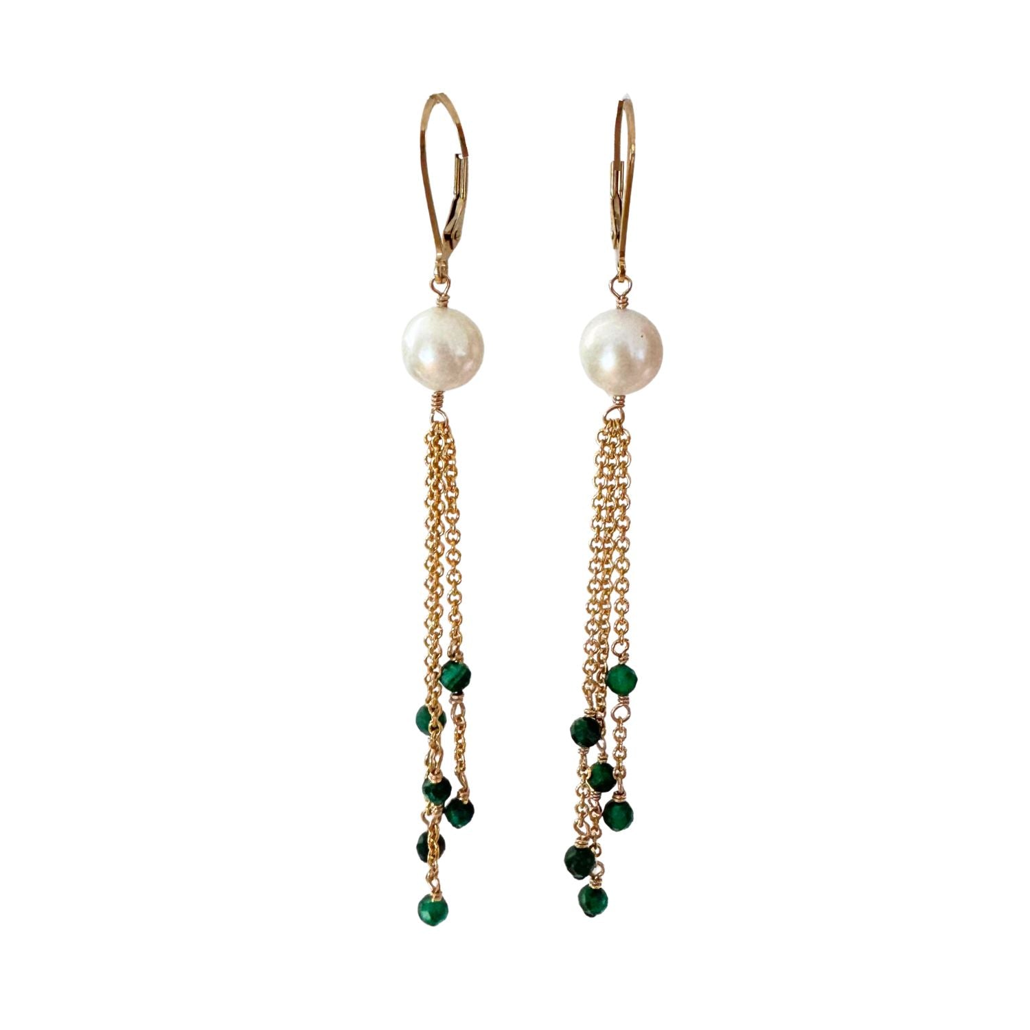 Pair of earrings with pearls and green beads on gold chains against a white background