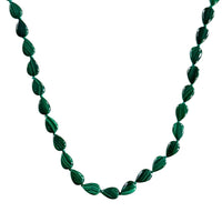 Genuine Malachite beaded necklace on a white background