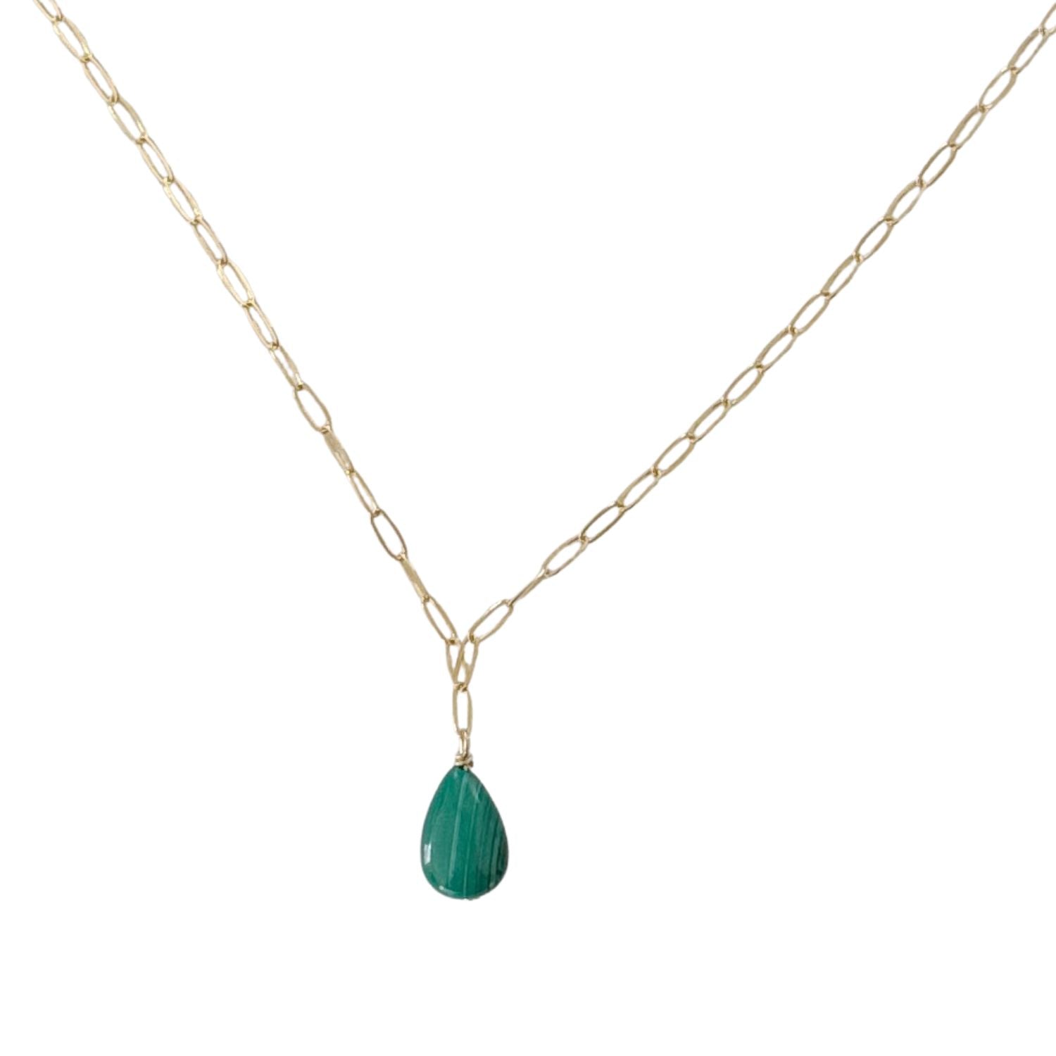 Gold chain necklace with a green malachite teardrop pendant on a white background