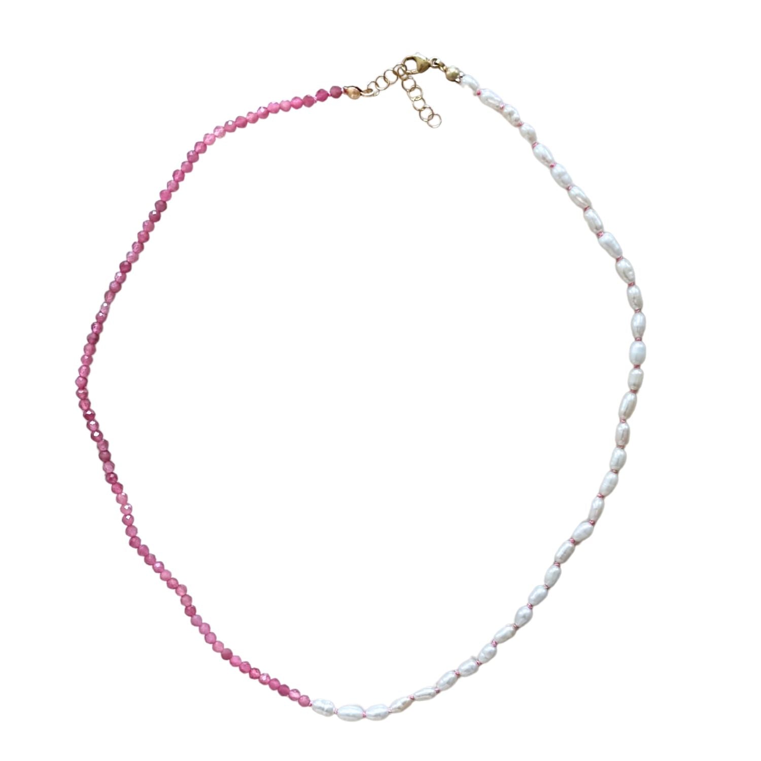 Necklace with pink beads and ivory pearls on a white background