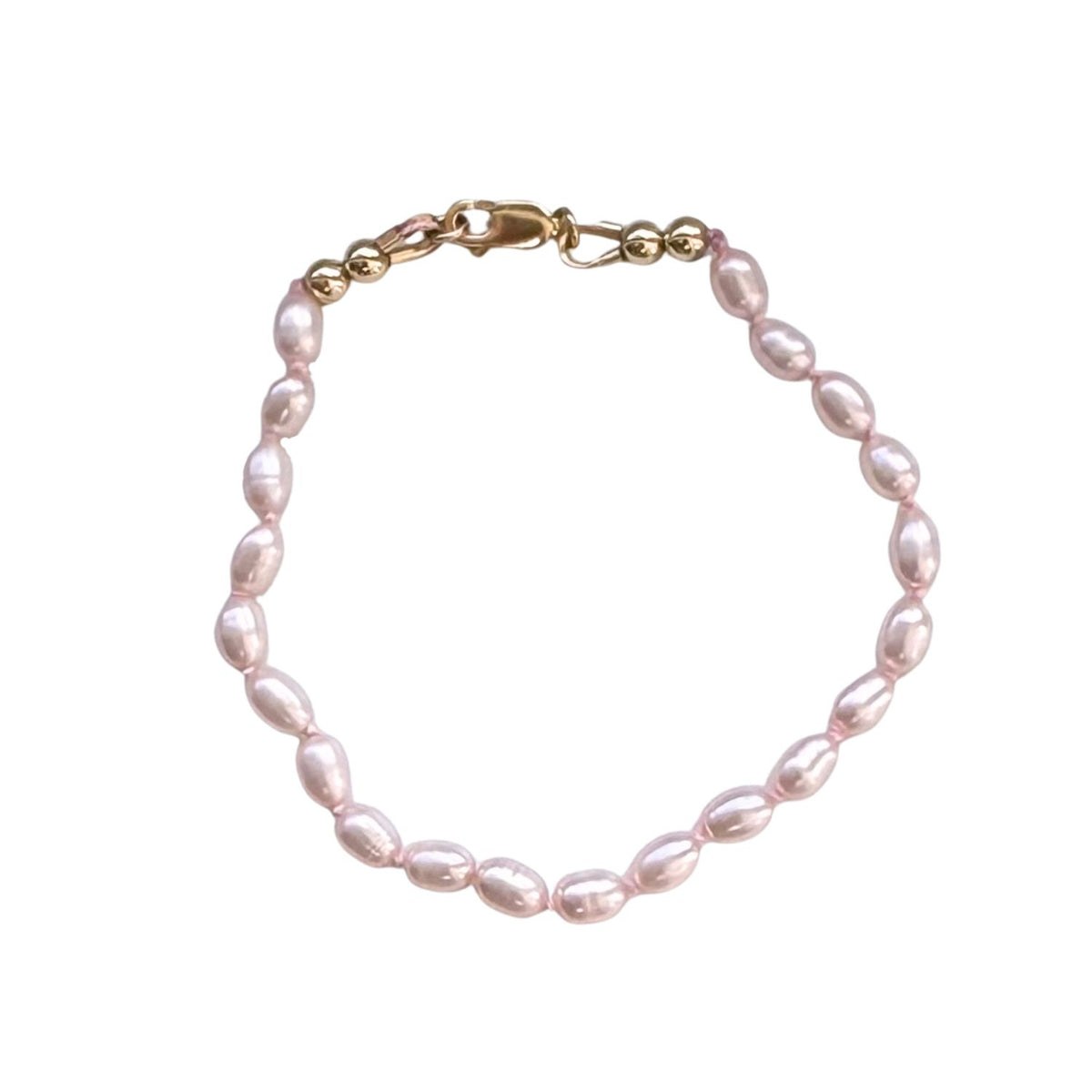 Freshwater pink Pearl bracelet with gold clasp on a white background