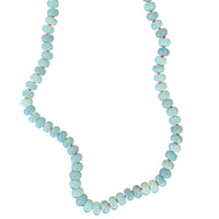 amazonite bead necklace with coral silk on white background
