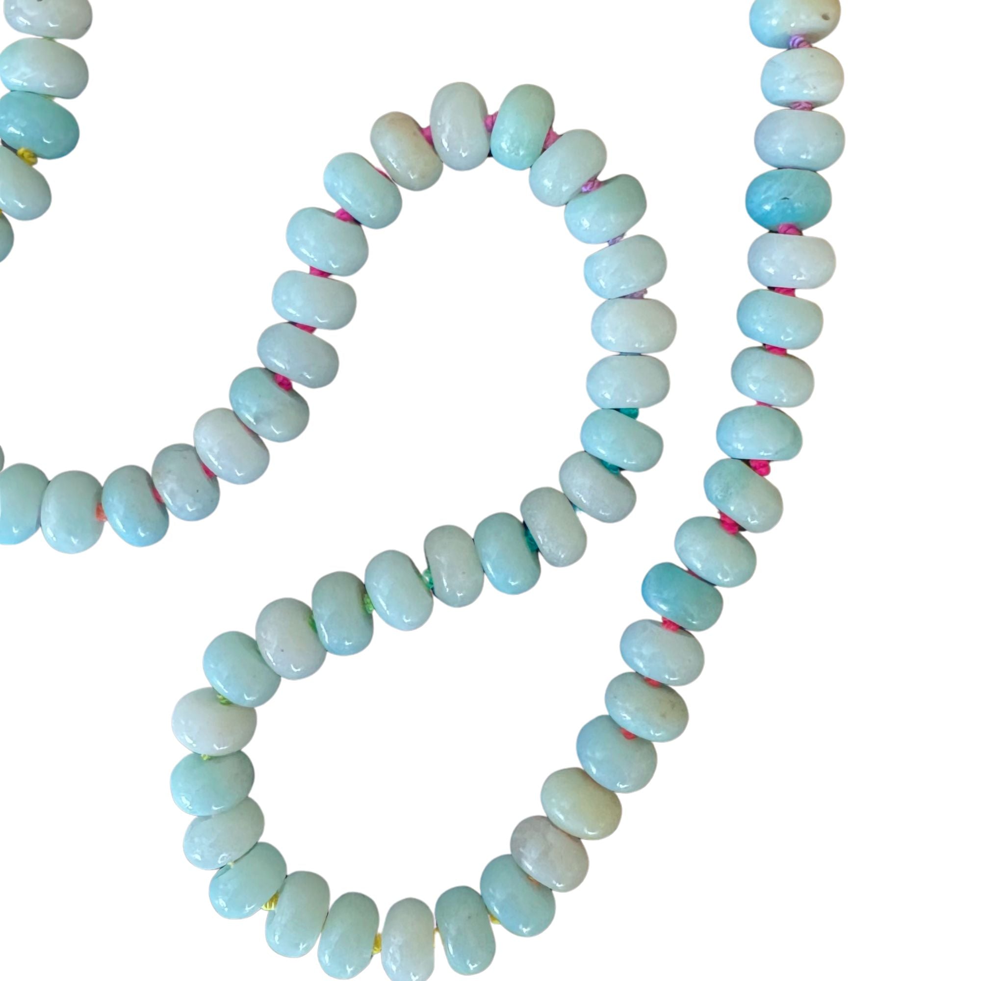 amazonite bead necklace with rainbow silk on white background