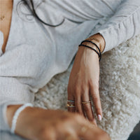 woman wearing fine gold and diamond jewelry