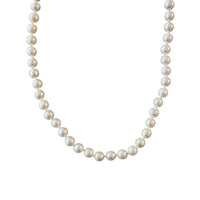 freshwater pearl necklace with ivory thread on white background