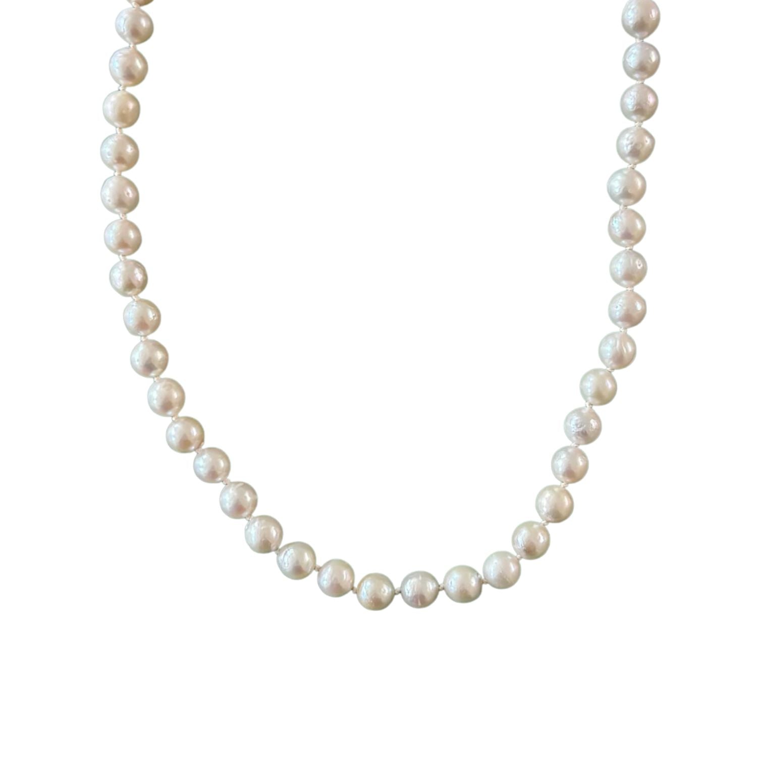 freshwater pearl necklace with ivory thread on white background