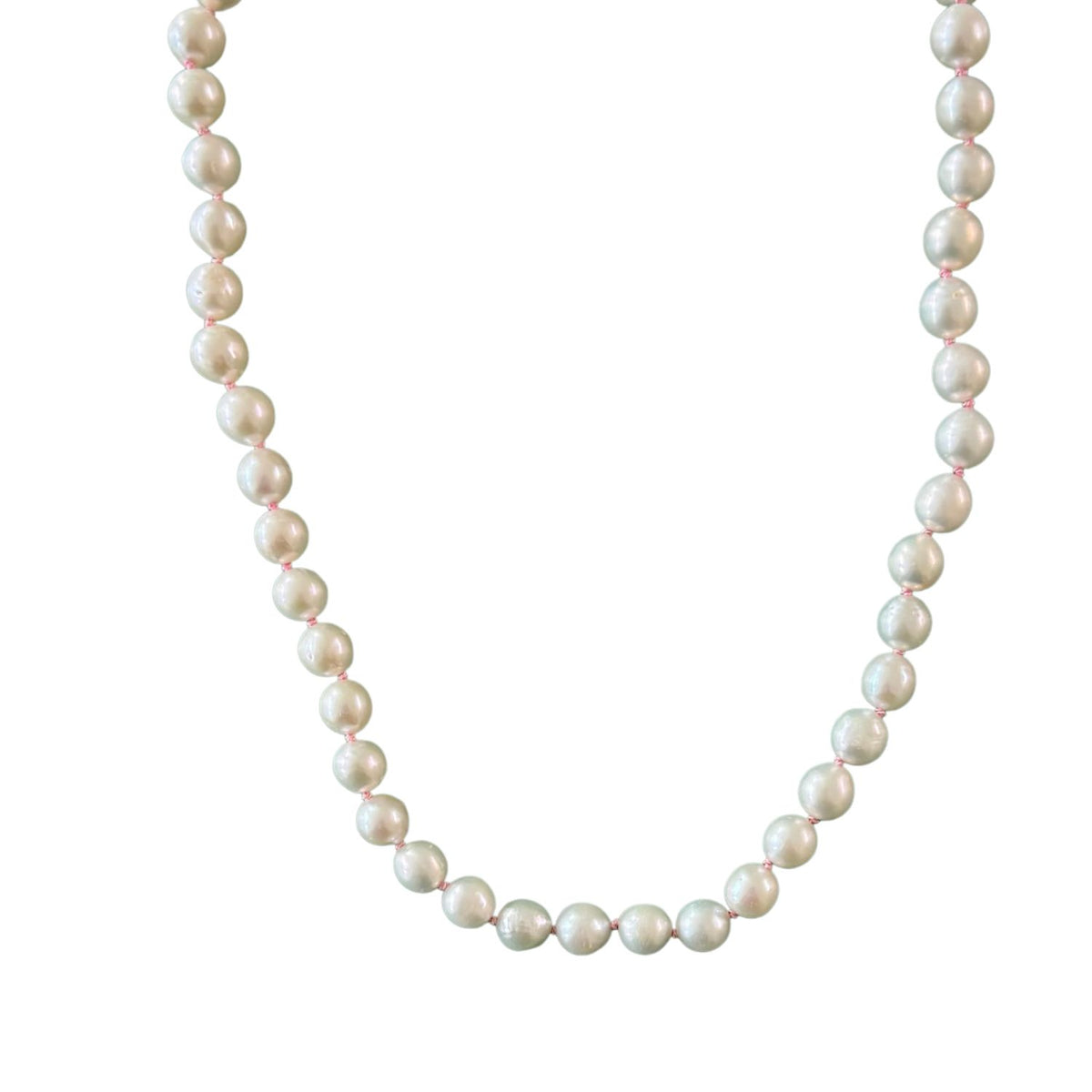 freshwater pearl necklace with pink thread on white background