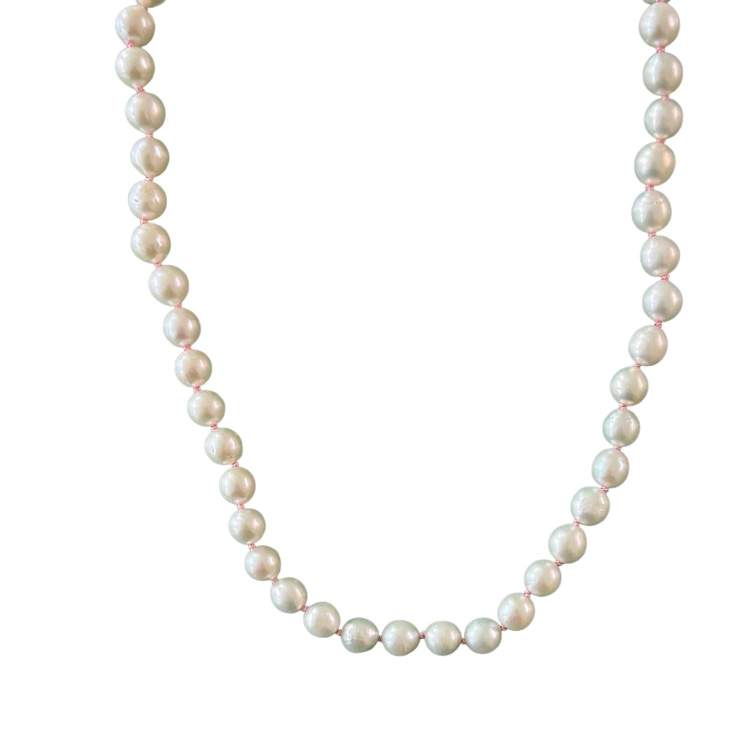 freshwater pearl necklace with pink thread on white background