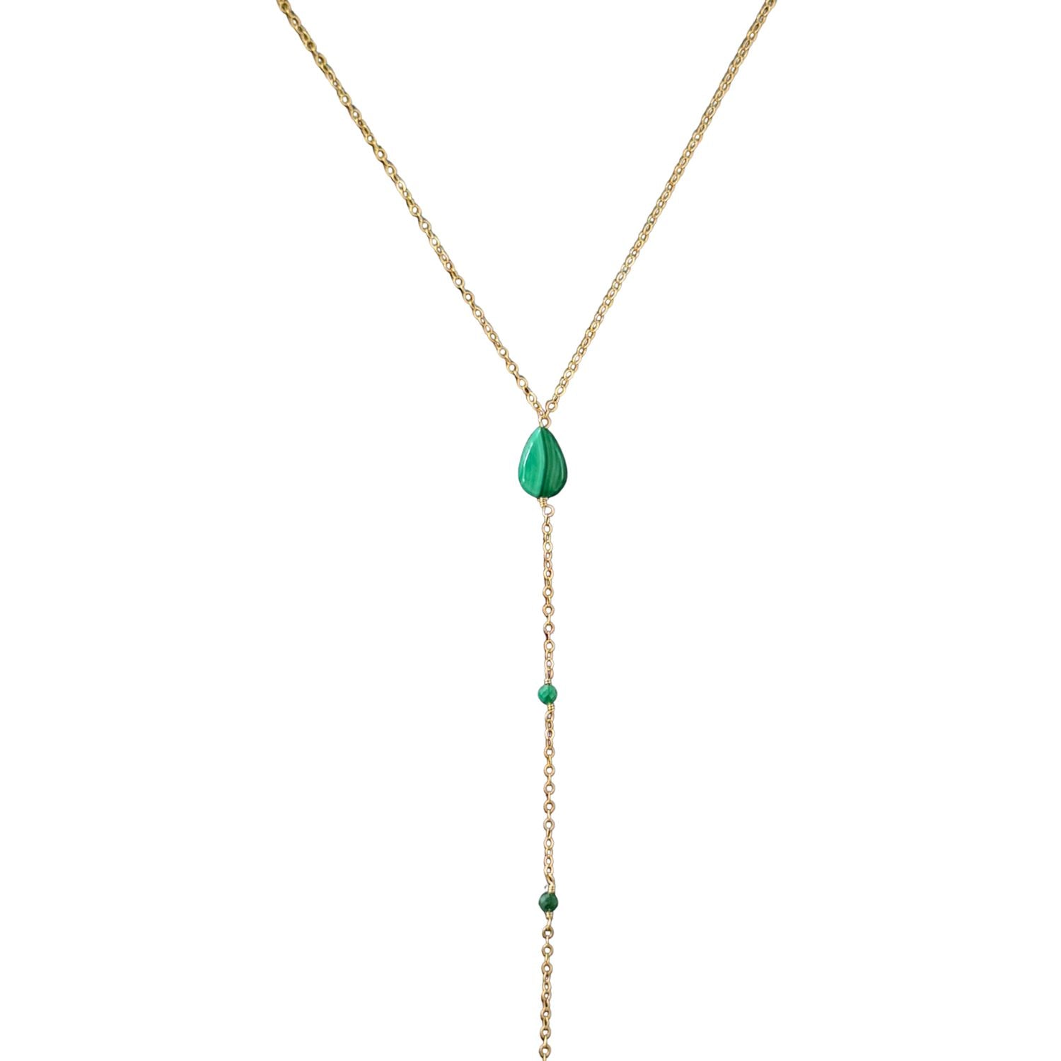 Gold necklace with green gemstones on a white background