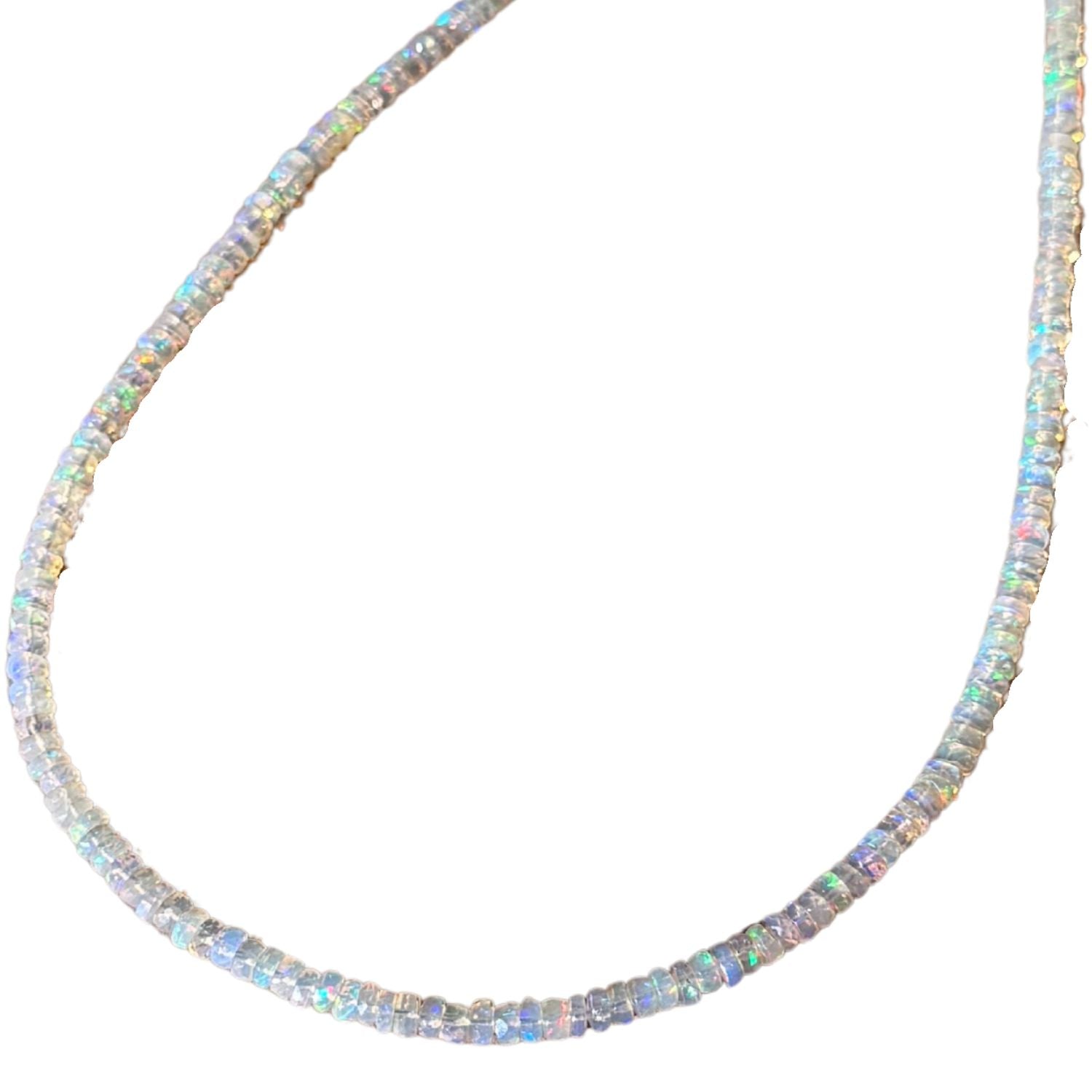 A beaded opal necklace made of small, round, iridescent opal-like beads arranged in a curved U-shape against a plain white background.